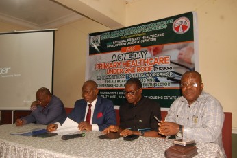 Akwa Ibom State Health Commissioner Dr. Dominic Ukpong (2L) and Chairman AKSPHCDA Dr. Martins Akpan (2R) seated at the high table.