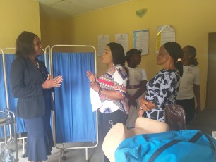 Dr. Angela Attah discussing with service providers at the PHC facility